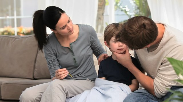 Couple taking care of their sick son