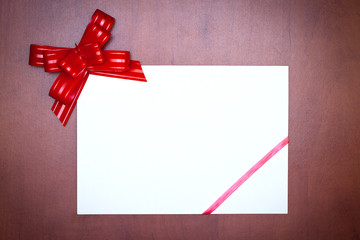 Red bow with paper card