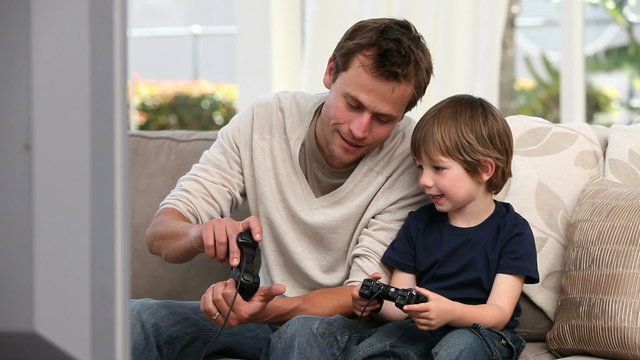 Boy playing with his father