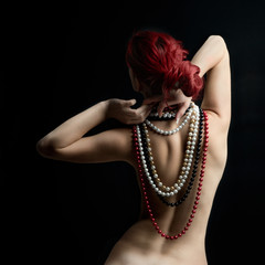 Naked torso with pearls