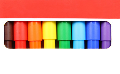 felt-tip pens of different colors in hole