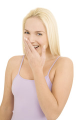 woman laughing with hand over mouth