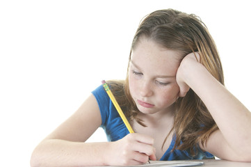 Young girl looking bored with work