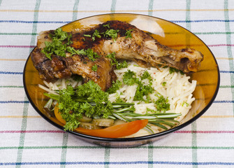 chicken with garnish on a plate
