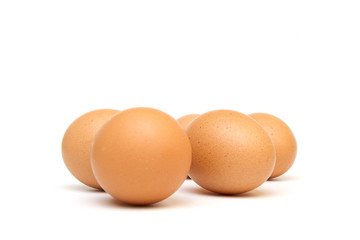 Five eggs on white background