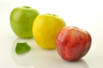 Naklejka na ściany i meble red,yellow and green apples close up
