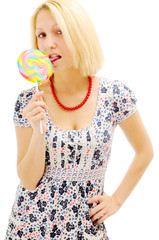 Attractive blonde licking lollipop
