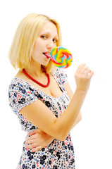 Attractive blonde licking lollipop