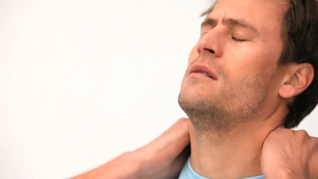 Handsome man having a headache against a white background