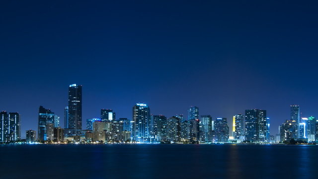 Time lapse of Miami skyline at night - slow zoom in