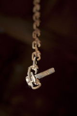 Rusty Screw on a Chain