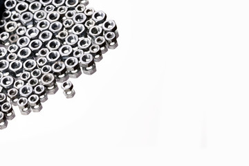 Screws and nuts top view in mirror