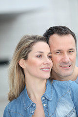 Portrait of happy couple standing outdoors