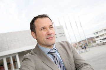 Businessman standing outside the office