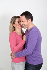 Woman whispering to her boyfriend's ear