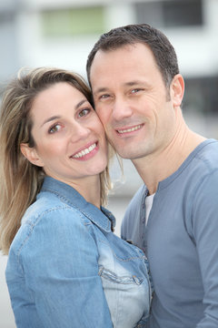 Portrait of happy couple standing outdoors