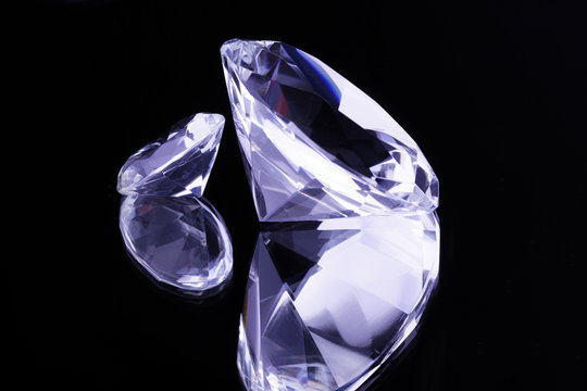 Crystal gemstones on black mirror