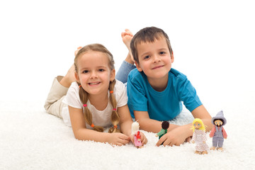 Obraz na płótnie Canvas Happy kids boy and girl playing on the floor