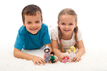 Obraz na płótnie Canvas Happy kids with toys on the floor