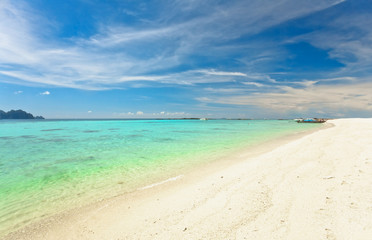 Fototapeta na wymiar Tropical beach under blue sky. Thailand