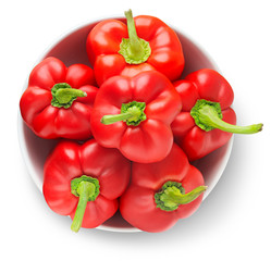 Isolated peppers. Bowl of red bell peppers shot from above isolated on white background