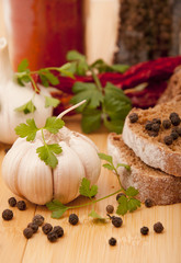 Garlic and pepper with other spices on the kitchen table