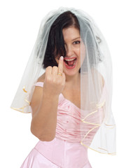 At last! I bride laughing and pointing to her wedding ring
