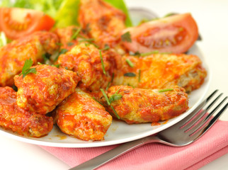hot chicken wings with salad