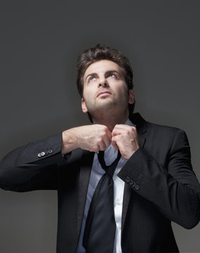 Businessman Loosening Tie