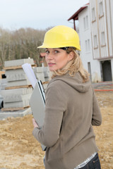 Woman engineer standing on construction site