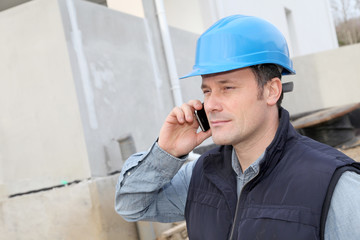 Supervisor talking on the phone on construction site