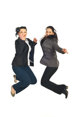 Two business women jumping