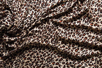 Close-up of a folds of stylish leopard scarf.