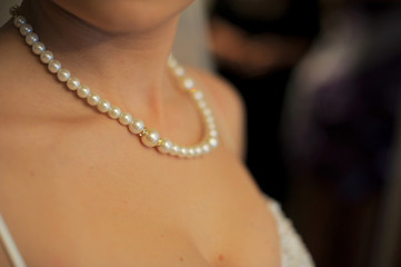 pearl necklace on bride's neck