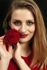 Beautiful girl with red rose