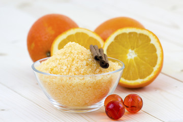 bowl of orange bath salt with fresh fruits - beauty treatment