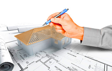 hand pointing on a house model