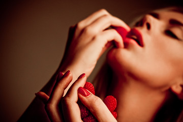 girl with red raspberry