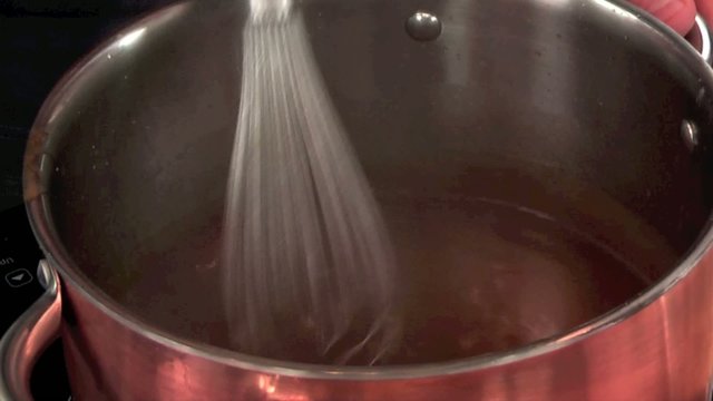 stirring brown sauce