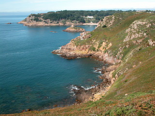 Yachts moored in the sandy cove of Portelet Bay, Jersey