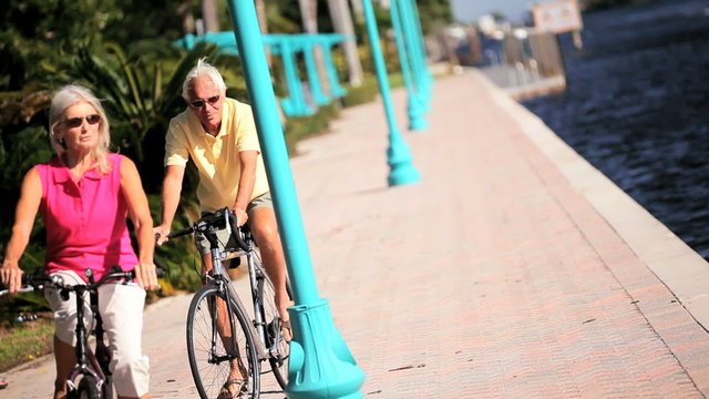 Active Older Couple Cycling to Keep Fit