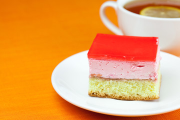 lemon tea and cake on the orange fabric