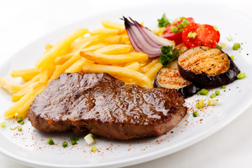 Steak with chips and vegetables