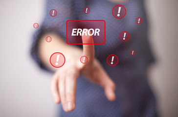 hand pressing ERROR button