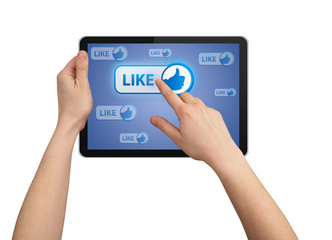 hand pressing LIKE button in tablet pc