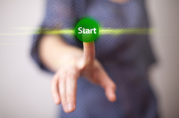 hand pressing start button