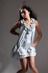 Fototapeta premium Sexy fashion model poses in short dress
