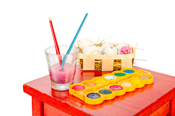 Painting easter egg. Easter eggs on red old wooden table