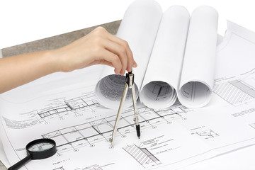 Architect working with blueprints.