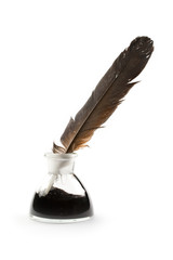 Feather and ink bottle isolated on white